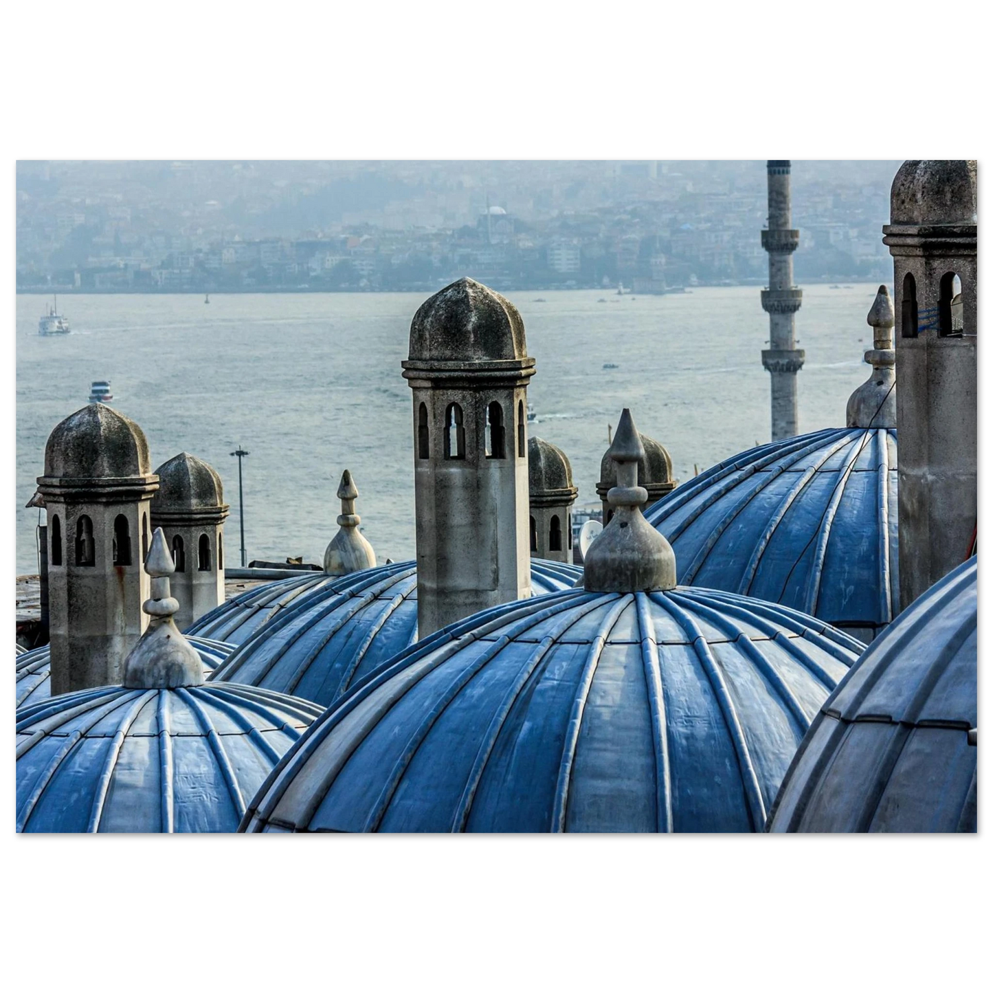 Fine art photo of soft blue domes overlooking the sea and city, minimalist and bohemian style