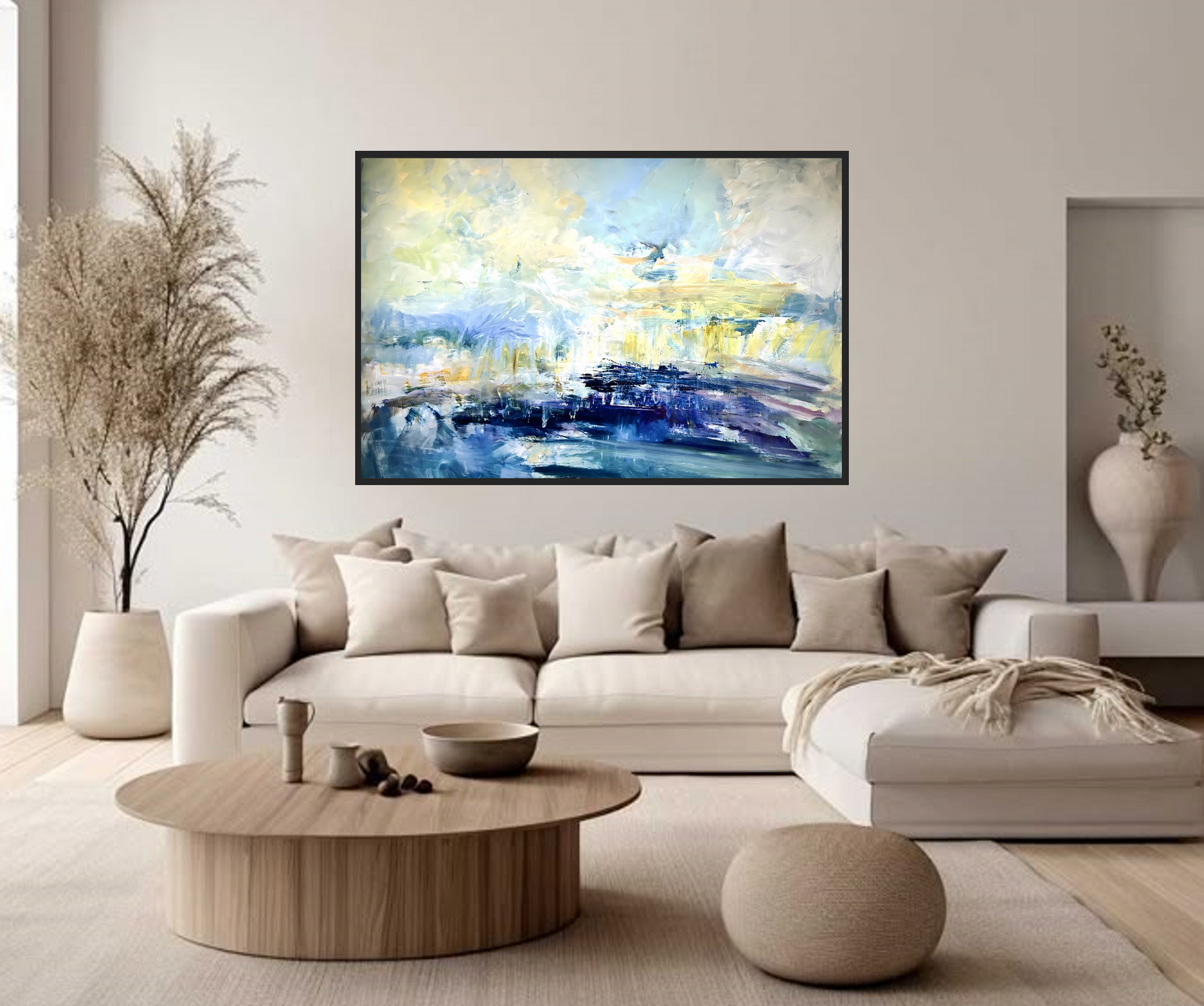 Modern living room with a beige sectional sofa, wooden coffee table, and abstract painting on the wall.