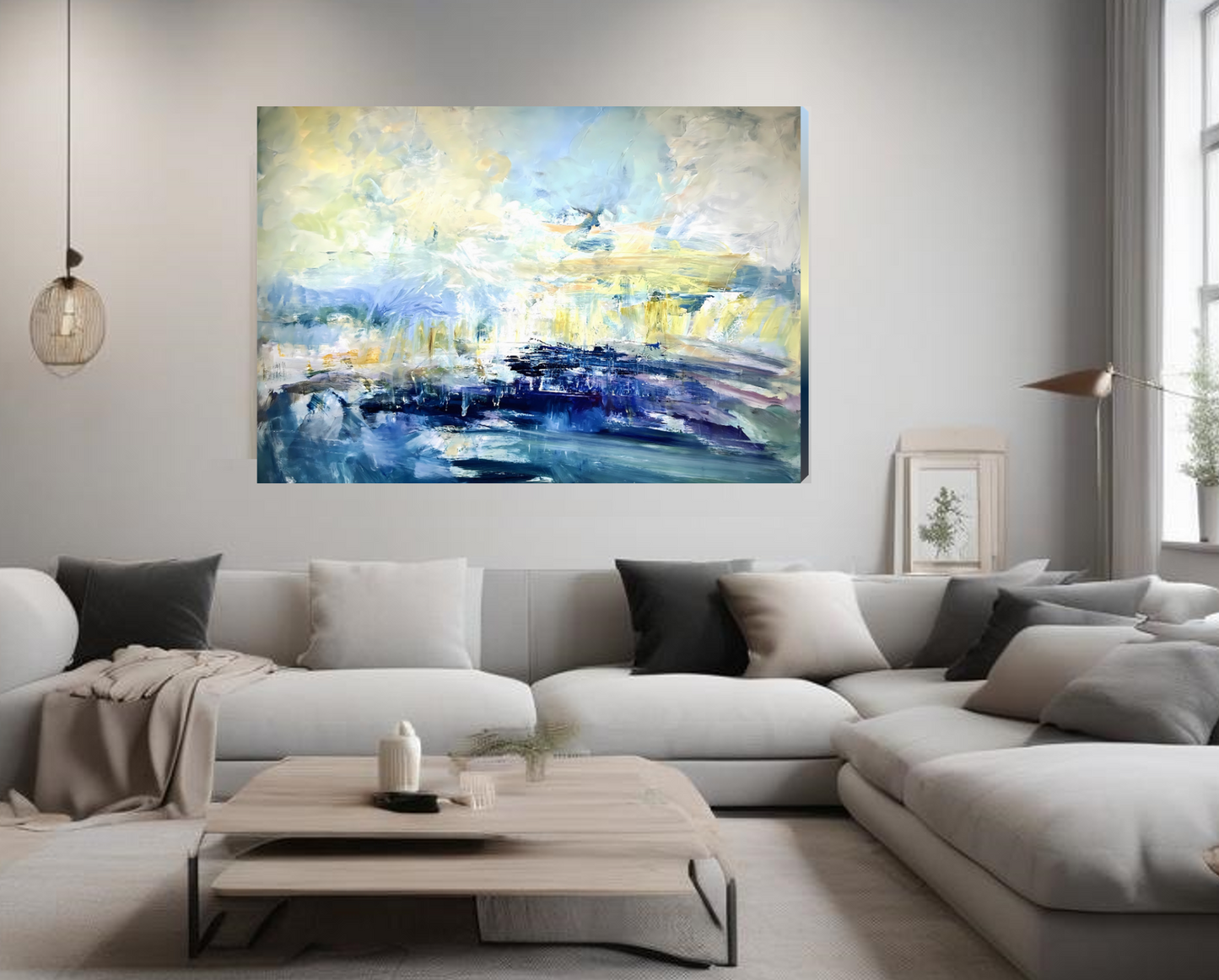 Modern living room with a large abstract painting on the wall above a sectional sofa.