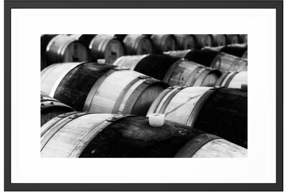 Stack of barrels in a black and white photography, printed in museum quality materials plus frame.