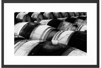 Stack of barrels in a black and white photography, printed in museum quality materials plus frame.