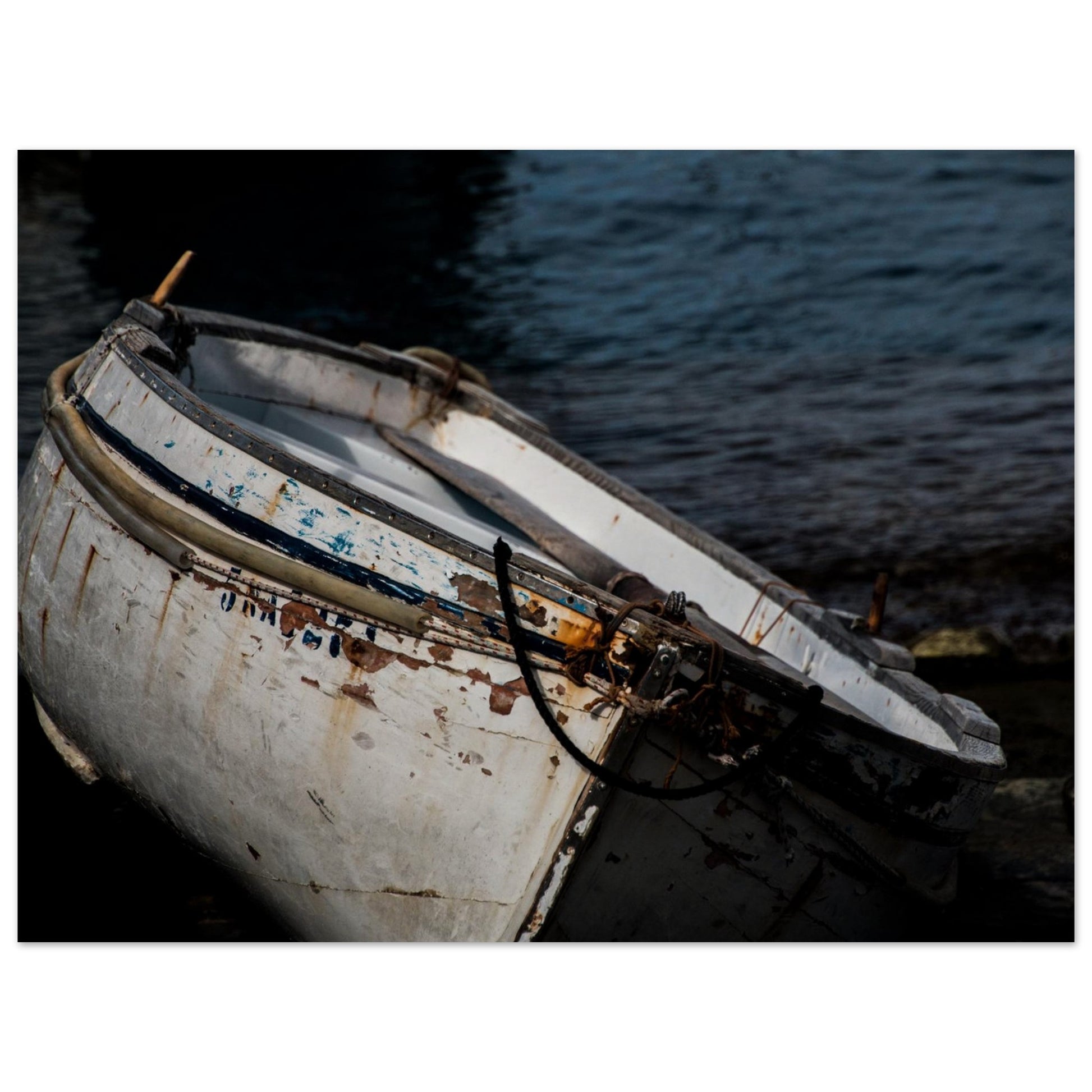 A fine photography of a boat with white and blue details surrounded by water printed in high quality metallic