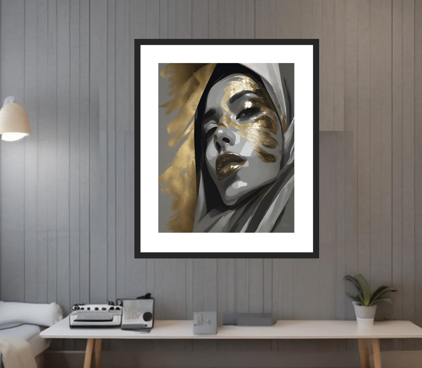 Framed artwork of a stylized face with gold and black accents on a wall. The perfect piece of decoration for modern and minimalist spaces.