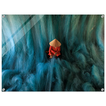 Person in a red outfit and straw hat sitting amidst large blue lines of cotton that simulates a beautifull green-blue waterfall, printed in acrylic.