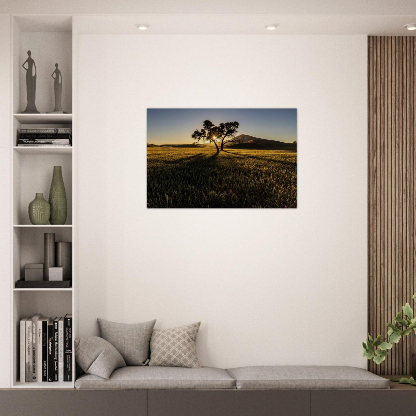 Modern living room with a wall art of a tree in a field.