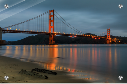 Golden Gate Bridge at night with reflection in water, San Francisco