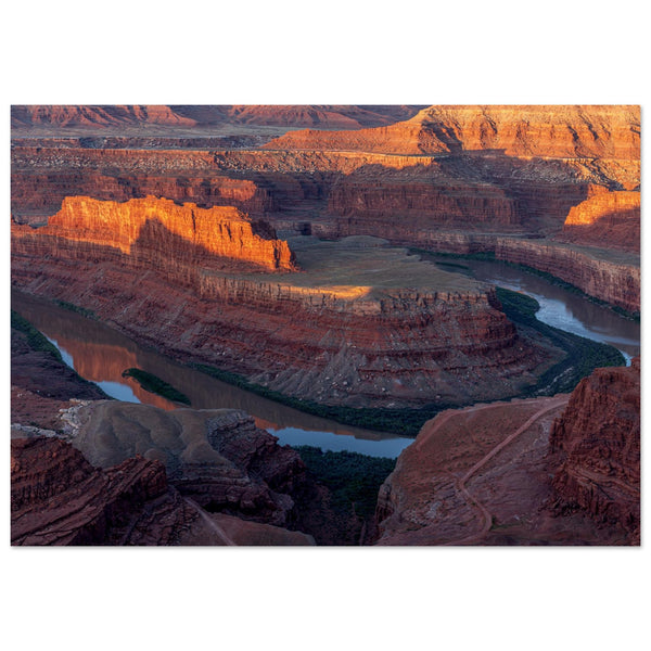 Awe-Inspiring Photography of the Grand Canyon capturing the layers of eroded rock formations, where warm hues of red and orange dance gracefully creating a dramatic tapestry of geological wonder. Poster.