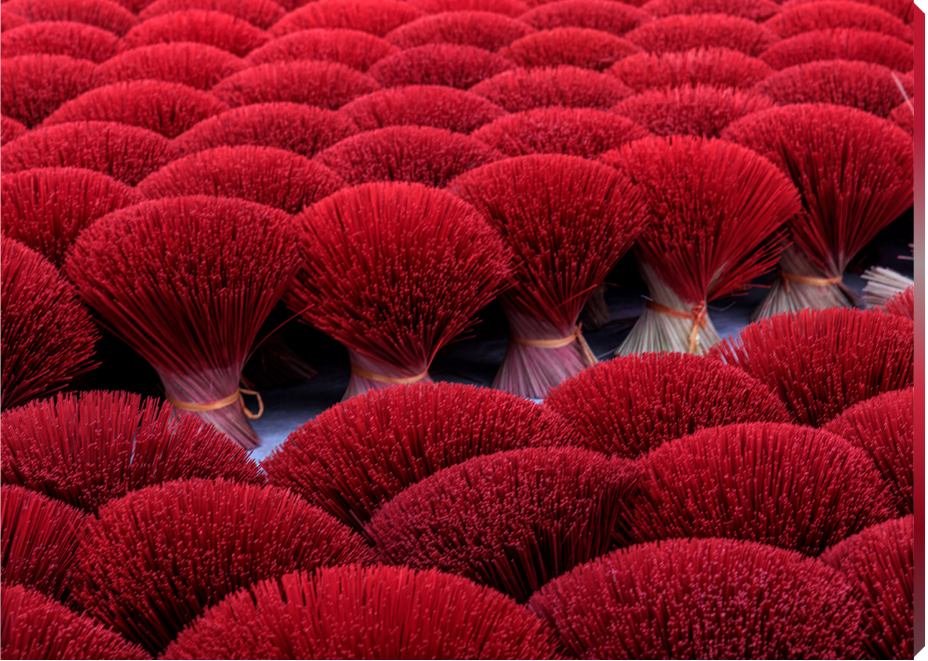 Close-up of red incense sticks in packaging