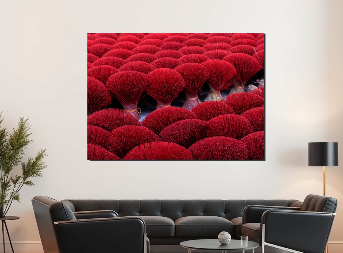Living room with a large TV screen displaying red floral pattern, black sofa, and decorative items.