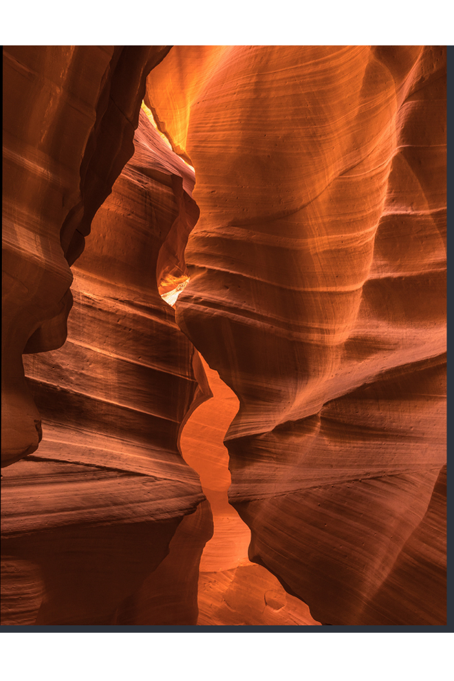 Narrow slot canyon with orange and brown rock formations