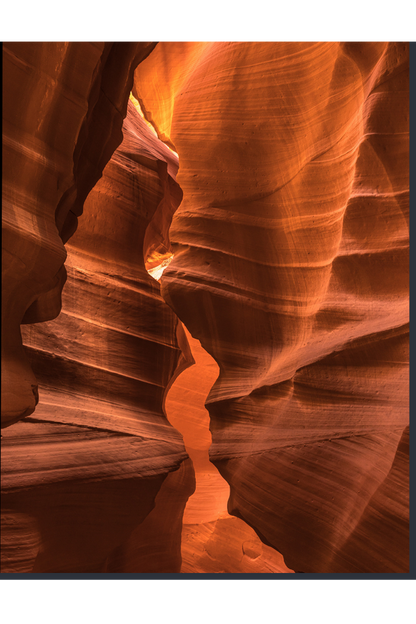 Narrow slot canyon with orange and brown rock formations