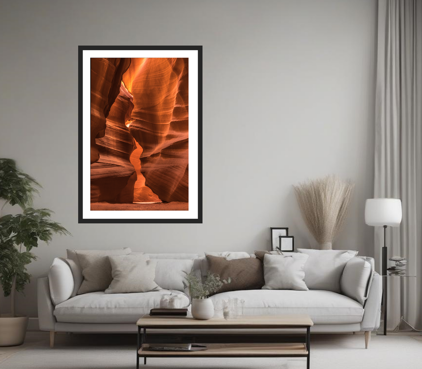 Framed artwork of a canyon wall in a living room setting with a sofa and decor.