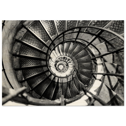 A Black and white photography of an  elegant spiral staircase. High-end wood printing.