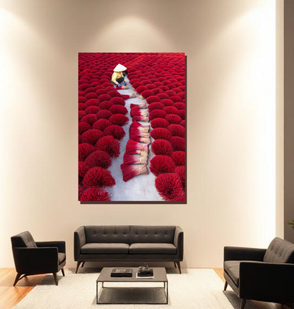 Living room with a large wall art depicting a person walking through a field of red flowers.