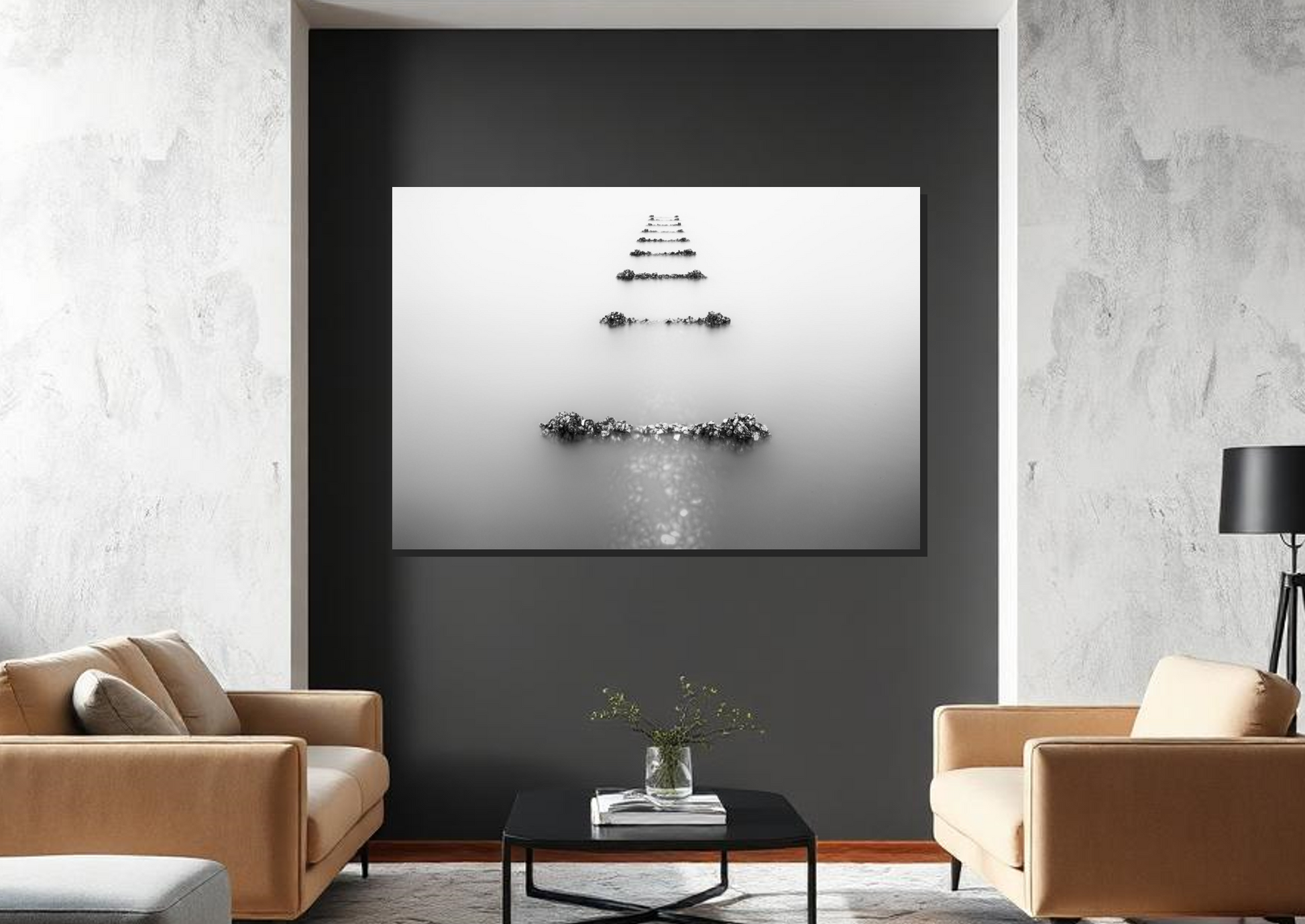Modern living room with a black and white abstract painting on a gray wall.